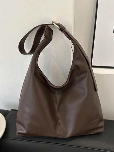 Dark brown tote with rounded handles and gold-tone front detail